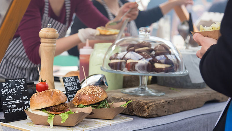 Food Festival Burgers and cakes on a counter