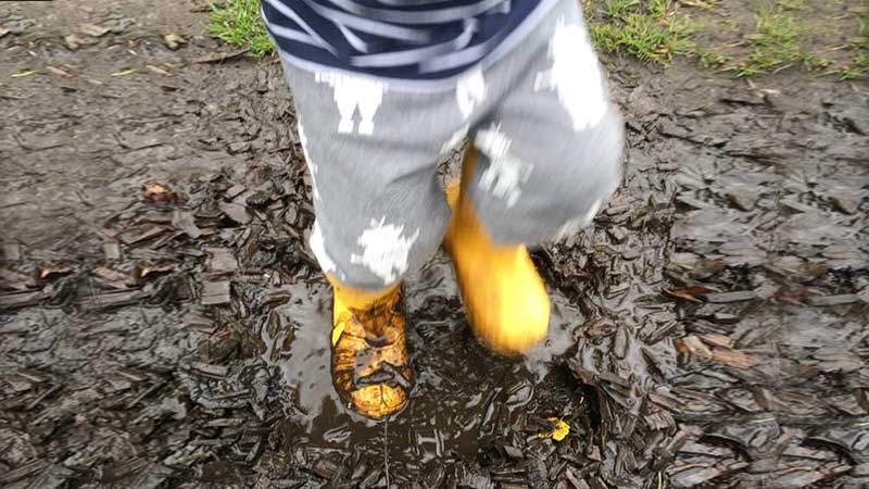 Welly Walk Child Splashing in a Muddy Puddle