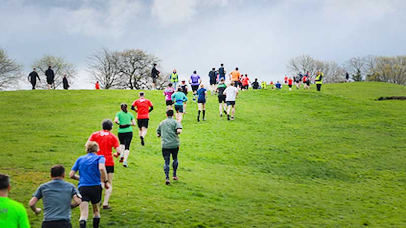 Macclesfield Parkrun competitors running through the park