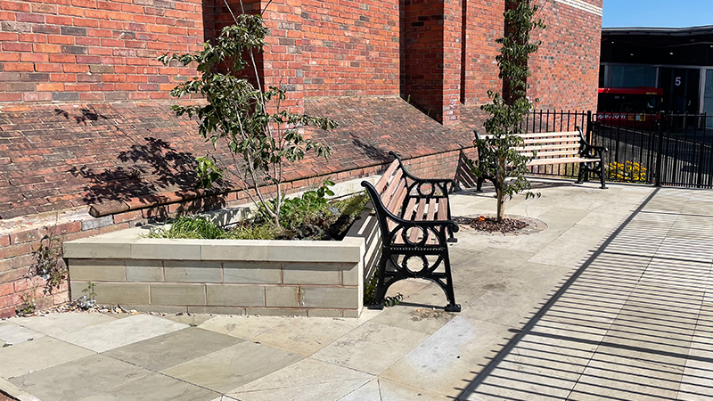 Pocket Park bench and border of flowers