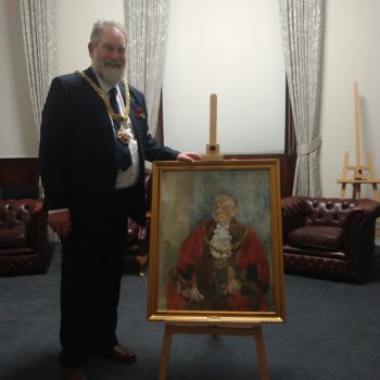 Mayor of Macclesfield with portrait of 1964 Mayor Victor Farr